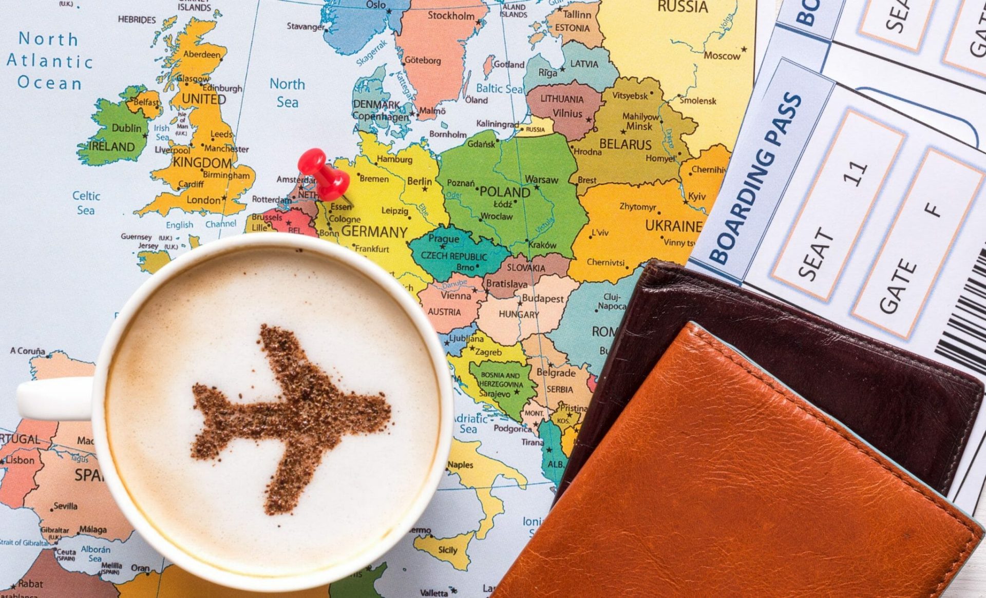 Airplane,Made,Of,Cinnamon,In,Cappuccino,,Passports,,Europe,Map,And