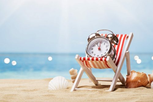 Alarm,Clock,On,Deck,Chair,On,Sunny,Tropical,Beach